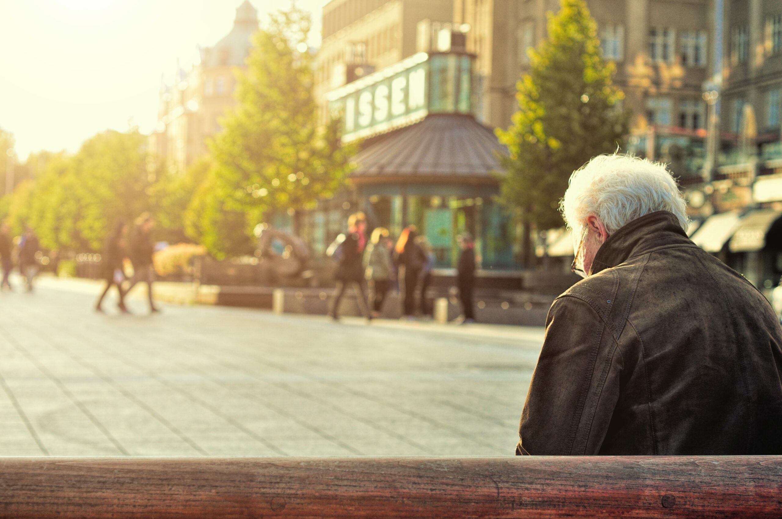 Lonely man sat on a bench